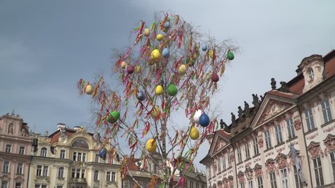 Spring 2016. 
Illustrative European tradition in Czech Republic
Easter festive decorations in Prague. Enormous eggs and colorful ribbon  hanging from a tree in the old Town Square. 