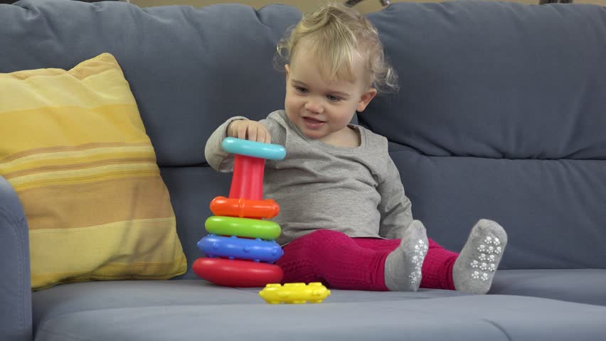 little baby playing with toys