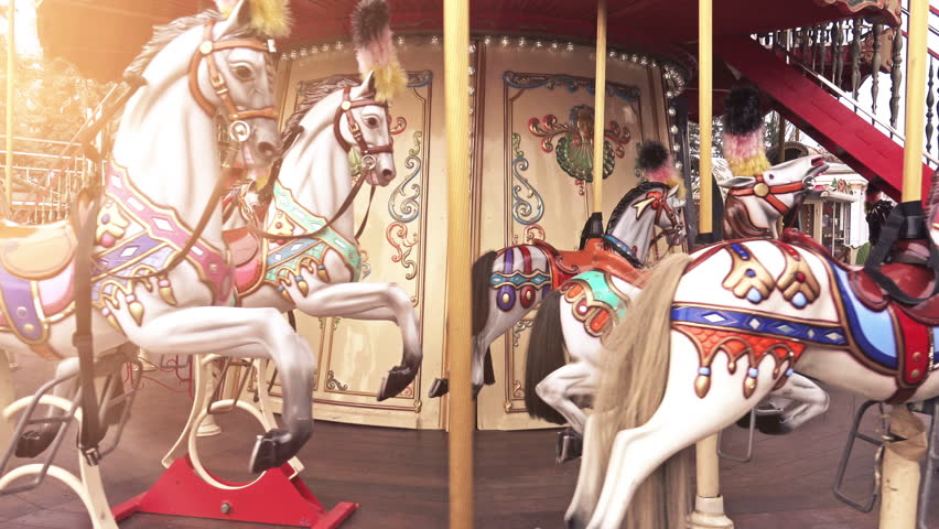 4K Traditional Fairground Vintage Carousel in the Park. Merry-go-round with horses. 4K Ultra HD 3840x2160 Video Clip