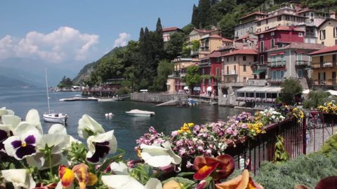 VARENNA, ITALY - CIRCA JULY 2015:   Flowers, boats and houses: a view of Varenna.  It is a magnificent village on the shores of  Lake Como, dates back to the 11th century.