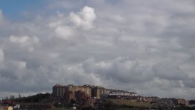 running white clouds in blue sky background over Valladolid,Spain. Accelerated video. Timelapse. No sound.