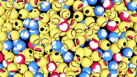 Facebook like button and empathetic emoji in the form of balls are falling on the surface. Social networking service. Matte included, ready for compositing, isolated on black. 3D render. Editorial.
