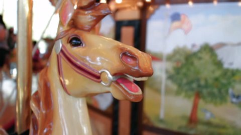 Close up of a horse on a carousel merry go round park attraction

