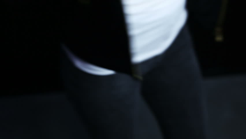 beautiful sexy young girl posing in the studio on a black background