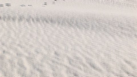 Tilt-up from foot prints in a sand dune at White Sands National Monument in New Mexico