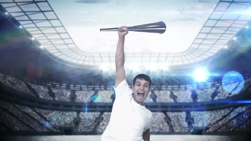 Montage of triumphing athlete holding Olympic torch over head on stadium background