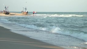 Hua Hin beach with the Couple and Small Thai local fishing boat