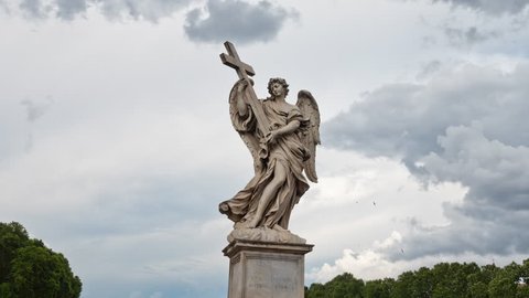 Time lapse with clouds behind the Angel with the Cross closeup on the Bridge of Hadrian (Ponte Sant’Angelo) in Rome, Italy. 4k resolution.

Sculptor: Ercole Ferrata.