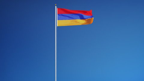 Armenia flag waving in slow motion against blue sky, seamlessly looped, long shot, isolated on alpha channel with black and white luminance matte, perfect for film, news, digital composition