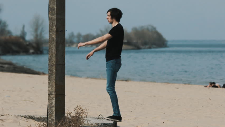 jumping backflip on the beach slow motion