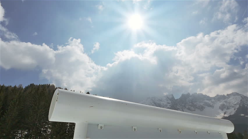 snowboarder riding jumping on kink rail slow motion