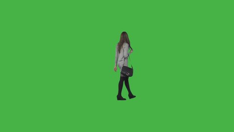 Tall girl in striped mini dress, black long socks & with bag strolls, looks around, views. On transparent background. File format - .mov, codec PNG+Alpha. Shutter angle -180 (native motion blur)