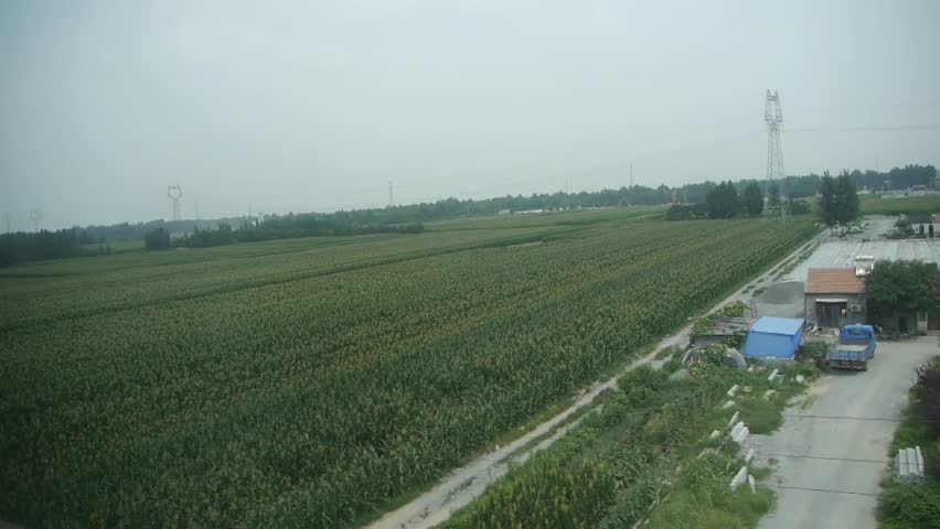 Villages plains tree crops farmland in rural countryside.Speeding train travel,scenery outside window. gh2_03023