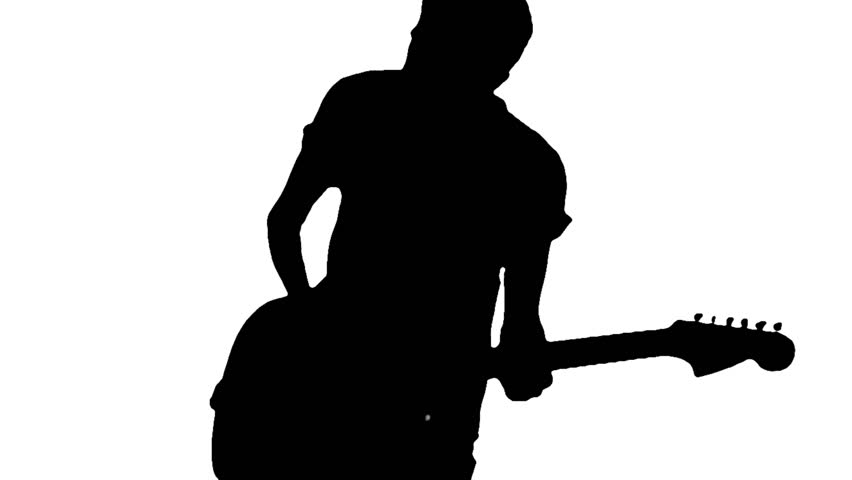 Silhouette of a young guitarist playing guitar energically