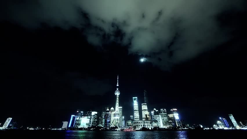 time lapse Shanghai at night,Brightly lit ship passing world business hub. gh2_06985