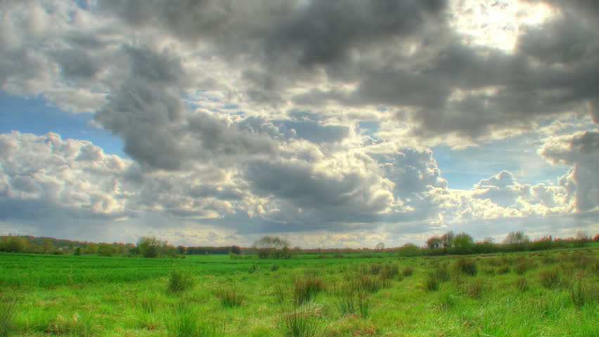 Storm clouds over fields, HD time lapse clip, high dynamic range imaging (hdr)
