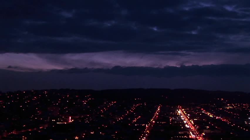 Aerial pan across the San Francisco area at night