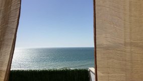 Beautiful blue ocean sea, sky view background. Wind blowing curtain movements. Clip 2142