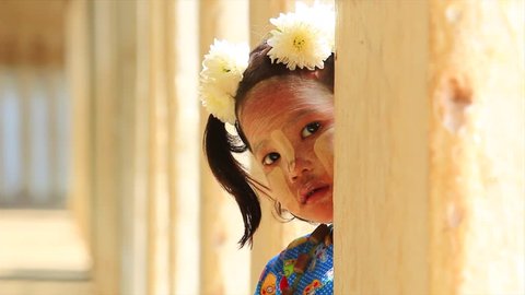 BAGAN - MYANMAR DECEMBER 8: Portrait of Burmese girl child with tanaka make up on face. on December 8,2015. of Myanmar 