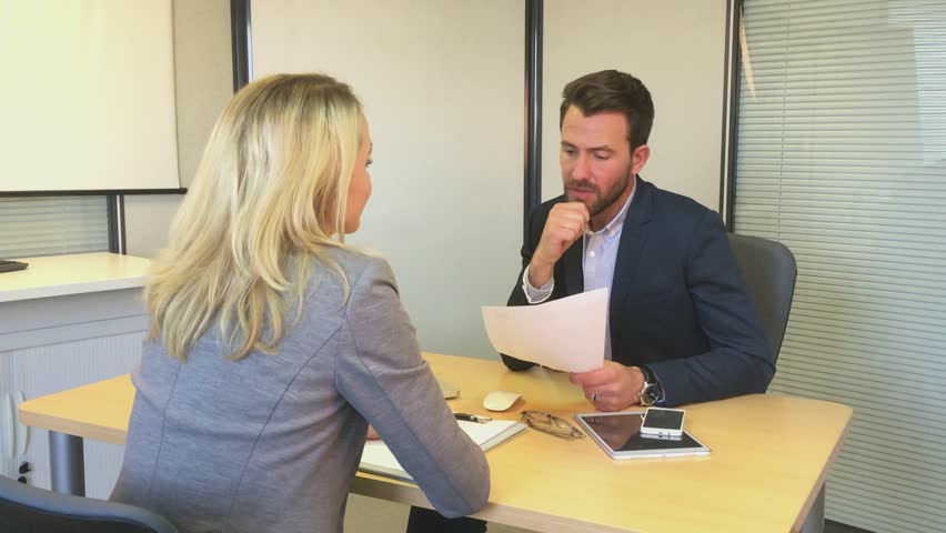 Young attractive woman during job interview