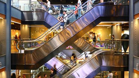 Escalator 4k shopping mall crowd of people buy shop center centre last minute sale sales purchases rush hour very busy full of clients big shopping mall complex time lapse timelapse fast video 