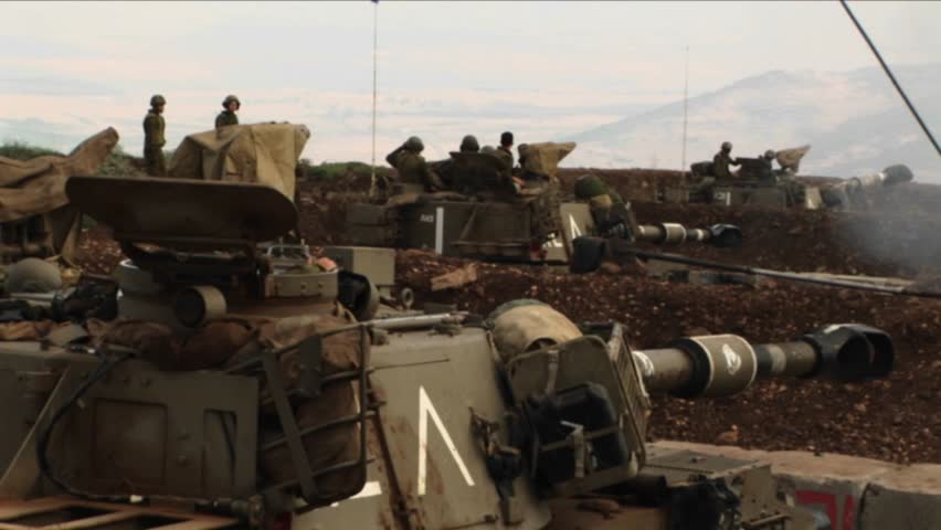 Israeli soldiers peer out of a tank during the Israel-Lebanon war.