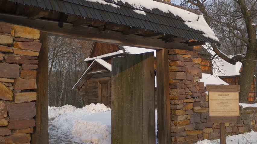 Entrance to Courtyard of a Wooden Church, Brick Obsolete Arch With a Door, Rustic House, Wooden Towers, Cross on a Top, Village is Around, Wintry Landscape of a Pirogovo Village, Old Wooden Church,