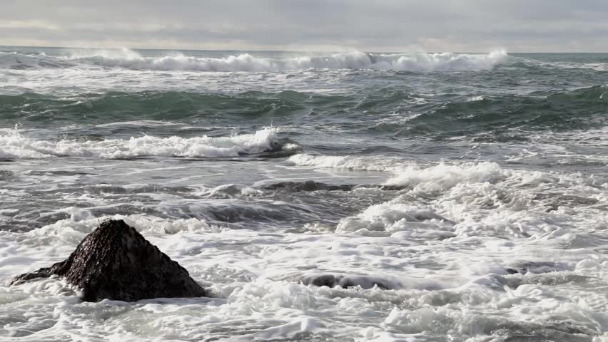 HD video of waves crashing on a rock on a Icelandic beach, shot after a storm, Filmed with a canon EOS 6D