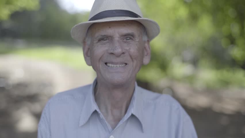 Outdoor portrait of smiling senior man in hat. Cinematic Video. | Shutterstock HD Video #15819865