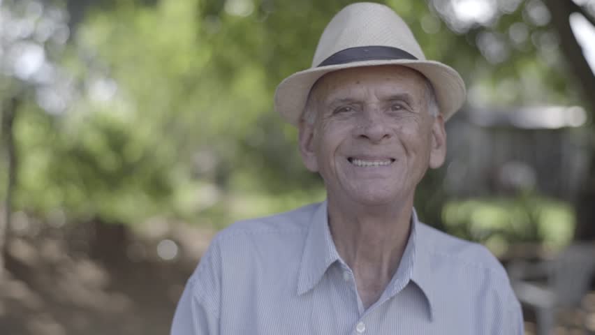 Outdoor portrait of smiling senior man in hat | Shutterstock HD Video #15819901