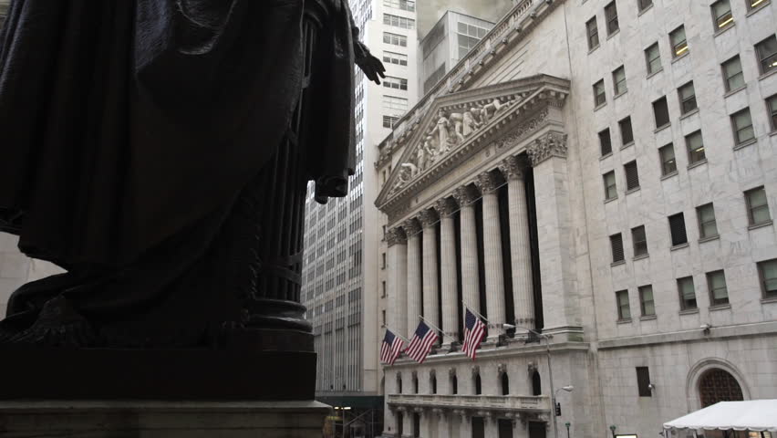 An establishing shot of New York's iconic Wall Street. In the heart of Manhattan's financial district. A hotspot for tourism and finance. New York, NY - March, 2016 Royalty-Free Stock Footage #15820273