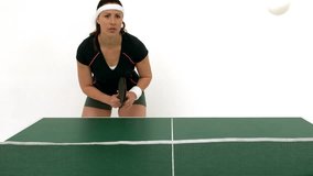 Portrait of attractive Caucasian woman hitting a ping pong ball - Powered by Shutterstock - Get 15% off with code: PIKWIZARD15