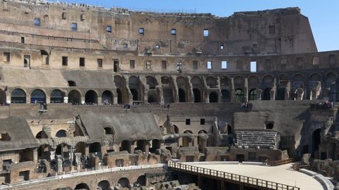 ROME, ITALY - OCTOBER 3rd 2015: 4k Colosseum Rome Italy Roman Coliseum famous Italian landmark travel icon forum with tourists walking and taking pictures