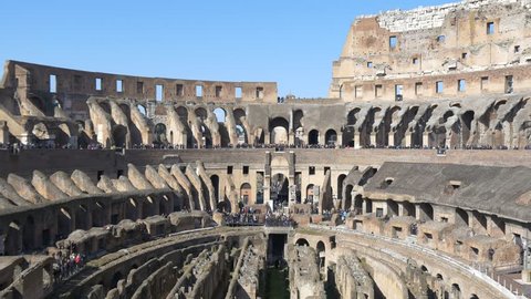 ROME, ITALY - OCTOBER 3rd 2015: 4k Colosseum Rome Italy Roman Coliseum famous Italian landmark travel icon forum with tourists walking and taking pictures