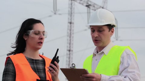 Supervisor and engineer for electric power considered plans ; Supervisor and engineer for electric power considered plans for electrifying and notifies using walkie-talkie,video clip