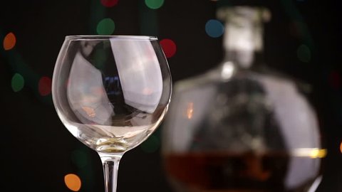 Cognac. Pouring Brandy from a Bottle