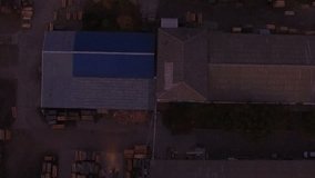 Aerial view of loaders transporting wood packages at night in warehouse  - Powered by Shutterstock - Get 15% off with code: PIKWIZARD15