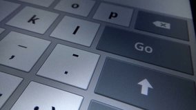 Finger pushing delete button on digital keyboard on touchscreen on iPad tablet device - Powered by Shutterstock - Get 15% off with code: PIKWIZARD15