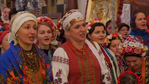 Kiev/ukraine - Jan 08 2016: People in National Clothes at the Holy Mountains Lavra, Dormition Cathedral, Ukraine, Christmas Celebration, Women in Flowered Shawls, Colorful Tapes on Their Heads,