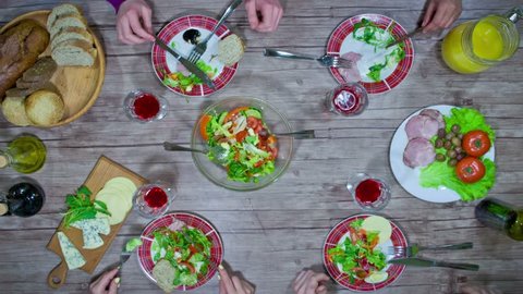 Eating salad with friends - stop motion animation, 4K, top view
