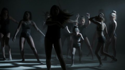 multi ethnic girls barefoot black leotard contemporary dance dancing powder spot light silhouette creative dramatic learning training