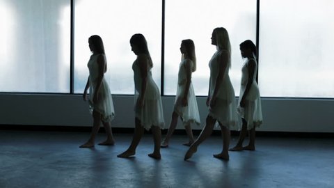 young multi ethnic girls children teenagers dance dancing school indoors window silhouette dress barefoot ballerina training