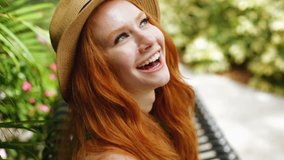 American USA young girl video diary selfie female smart phone Caucasian social media networking pretty redhead hair happy park
