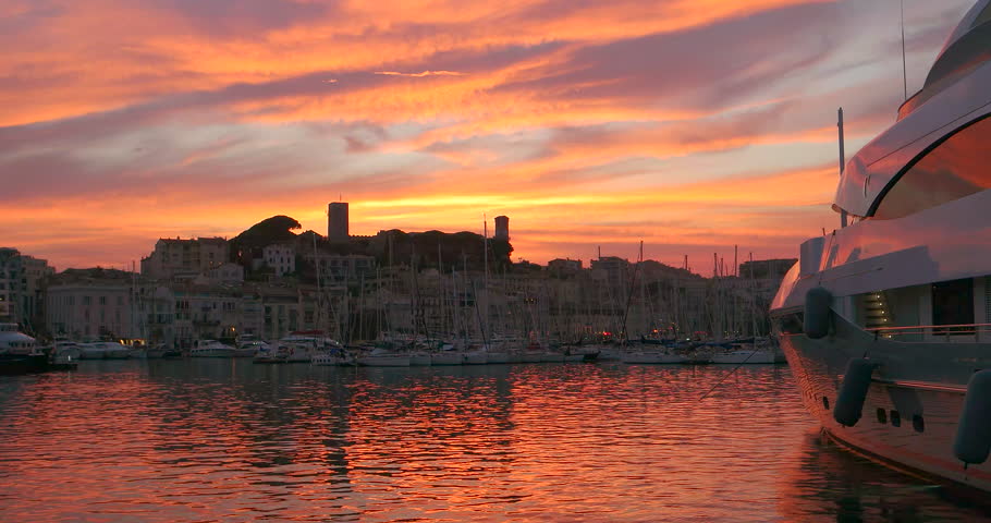 Cannes, France yachts in port. Mediterranean sea french riviera. City harbor summer sunset sky. Travel to szouth Europe, Provence. Luxury harbour coast landscape. Famous film festival, Cote Dazur town