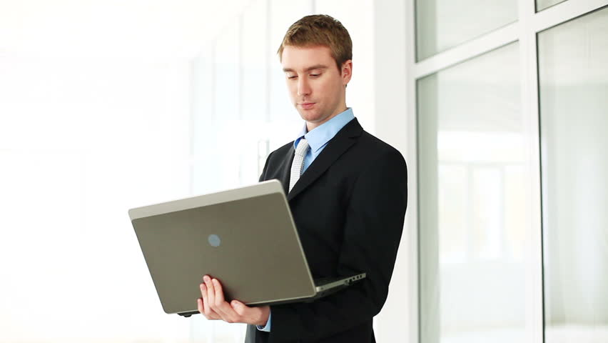 Businessman with laptop on the white background. DOLLY HD 