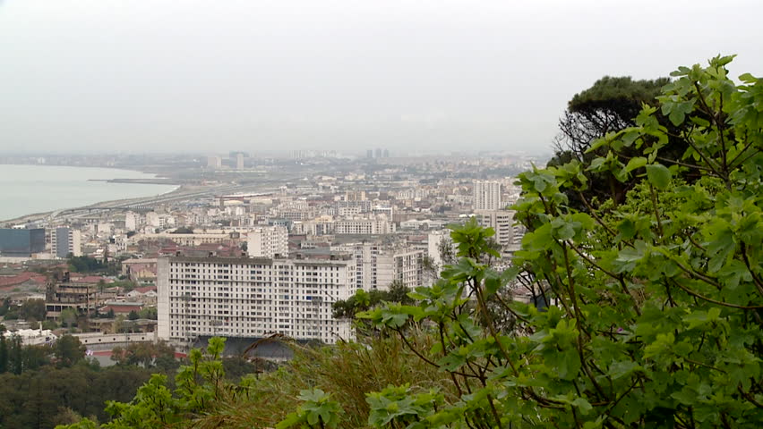 Locked off long shot of Algiers cityscape and harbour