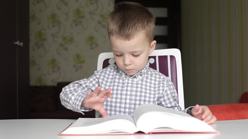 Boy Turning The Pages Of Stock Footage Video 100 Royalty Free Shutterstock