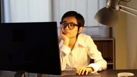 Asian woman working on computer table 