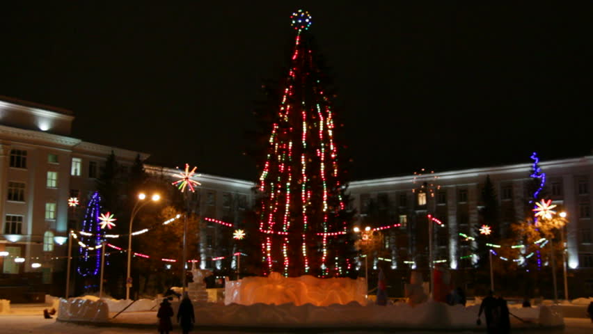 christmas fir on town square at night