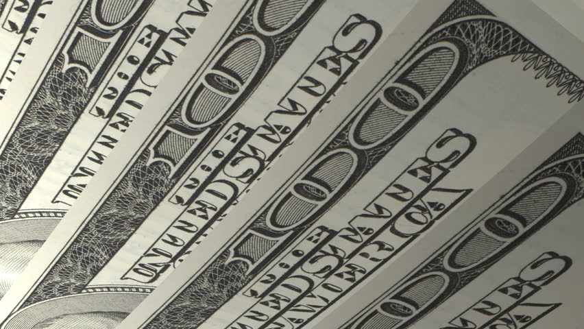 Macro of the numerical value on 100 dollar American bills, angled and